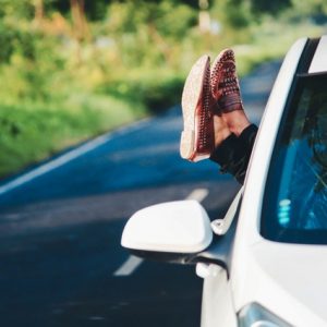 Person's leg out of the car